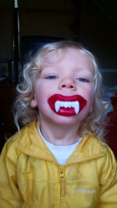 grandkid with vampire teeth
