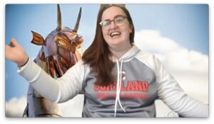 Sarah Wolf in Cortland gear in front of The dragon statue